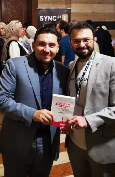 Book signing at the sync conference